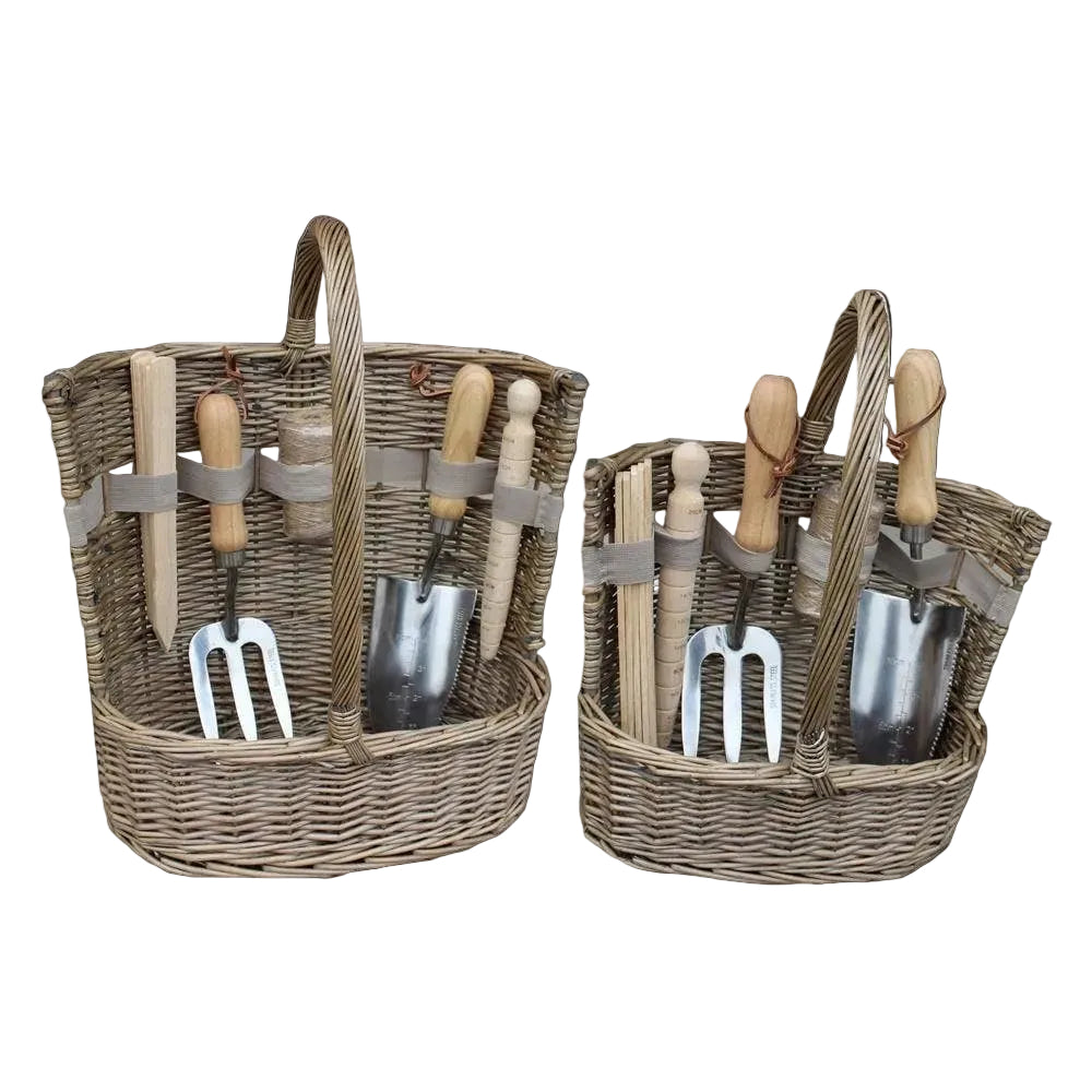 Two wicker baskets with gardening tools on a white background