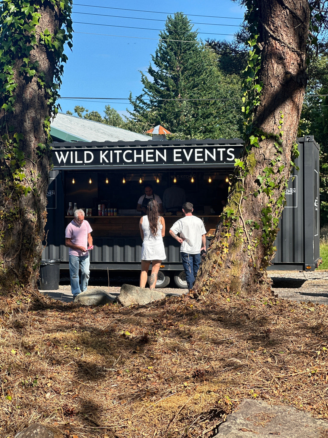 Customers ordering food at the Wild Kitchen pop-up at The Hideaway.