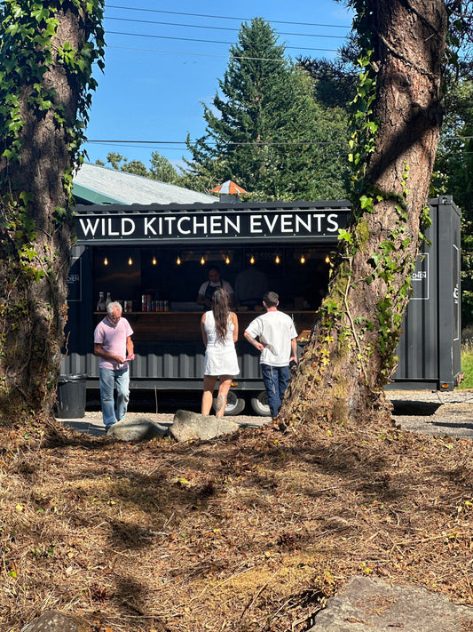 Customers ordering food at the Wild Kitchen pop-up at The Hideaway.