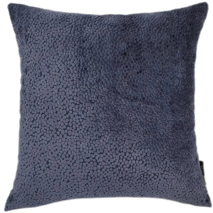 Textured blue pillow on a white background