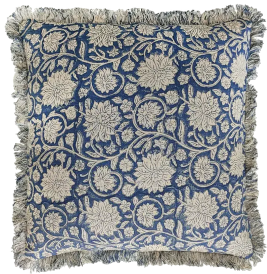Decorative pillow with floral pattern and fringes on a blue background
